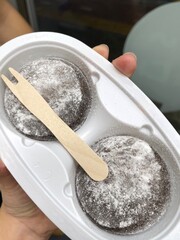 Mochi is a Japanese cake made from glutinous rice, pounded until it is soft and sticky, then shaped into a round shape. Various colors of mochi cake, traditional Japanese food
