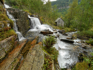 Waterfall in autumn Norwegian mountains. Long exposure time.