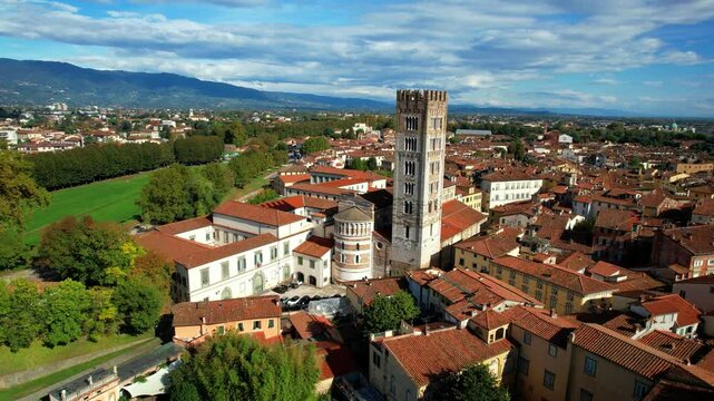 Italy ,Tuscany travel and landmarks. Lucca medieval historic town, 4k  aerial drone video of city center with famous towers and squares
