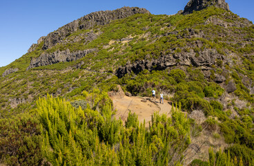 Tourists in the hiking trail in the mountains of Pico Ruivo in Madeira. Madeira island, Portugal