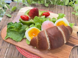 Soft-Boiled Egg Burger in truffle Salt Bread, served with mixed salad