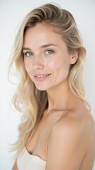Fototapeta premium Smiling Blonde Woman with Natural Makeup and Wavy Hair