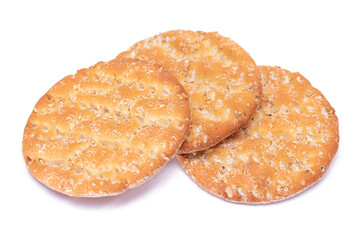 A Heap of Round Salt Crackers with Sesame Isolated on White Background. Dry Snacks - Isolation