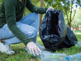 Woman of dedicated volunteers are participating in an environmental cleaning activity in a park....