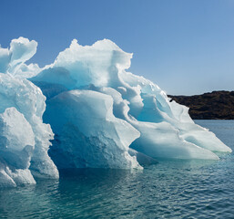 View of glaciers and icebergs in the fjords of South Greenland.