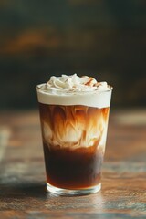 Swirling caramel cream in iced coffee