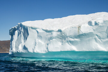 View of glaciers and icebergs in the fjords of South Greenland.