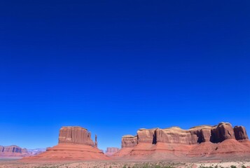 Fototapeta premium Cobalt Skies A deep blue sky dominates stark against the landsca