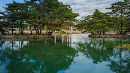 Fototapeta premium This is an autumn landscape of ponds, trees, and mountains around Gyeonghoeru Pavilion in Gyeongbokgung Palace in Seoul.