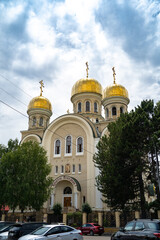 a beautiful Orthodox church. a stone temple. domes