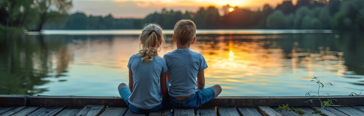 Fototapeta premium Children Watching Sunset Over Lake