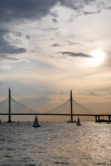 Fototapeta premium Cable-stayed bridge over the Petrovsky Fairway at sunset, Saint Petersburg, Russia