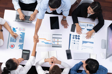 Top view diverse office employee worker shake hand after making agreement on strategic business...