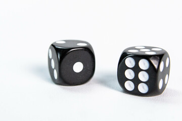 Black Dice on White Surface