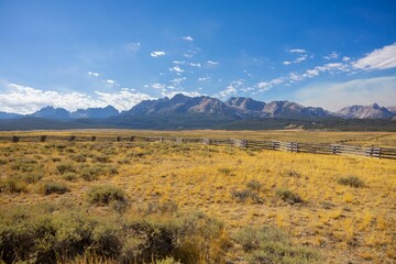 Fototapeta premium Scenic mountain view with wooden fence in Idaho.