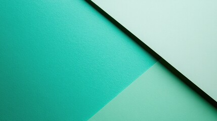 Diagonal division of textured and plain paper sheets forms line partitions Modern neo mint and green abstract dual tone background design Space for text Bird s eye view