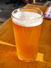 Glass of beer on the table in a restaurant