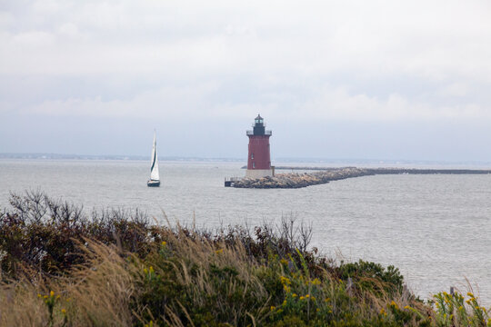 Delaware Breakwater Lighthouse and Small Sailboat