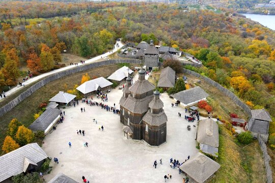 Ukraine Zaporizhzhia Cossacks. Old wooden vintage church and fortress stand on Khortytsya island, in Ukrainian city Zaporozhye. Drone view.