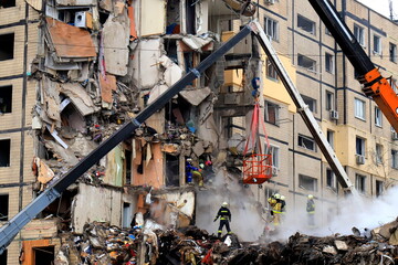 Russian missile strike destroyed residential building, Dnipro, Ukraine. Rescuers are looking for...