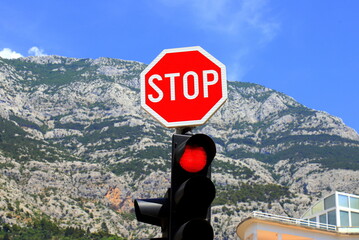 Road traffic sign STOP on a background of mountains in Croatia.