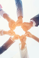 Vertical Partners hands together teamwork group of business people meeting in firm company office....