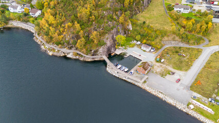 Aerial View of a Coastal Village with Green trees