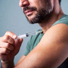 man holding syringe in hands, original photoset