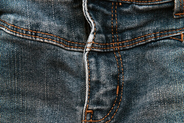 Jeans texture with seams close-up. Denim background. Seam