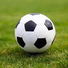 Fototapeta premium A close-up macro shot of a soccer ball spinning on a grassy field, with a rack focus effect shifting from the ball to the player's cleats in the background, captured in a Dutch angle shot for a
