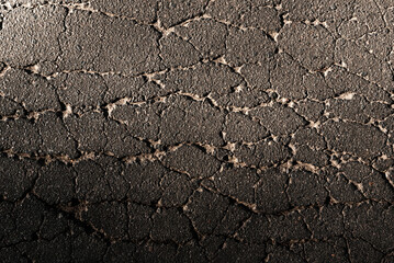 Cracked asphalt texture. Top view. Asphalt. Road background