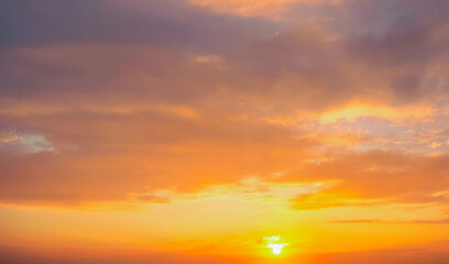 Sunset Sky Background, Sunrise with wispy clouds and real sun. Premium background for banner or poster.