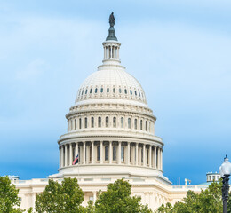 World famous United States Capitol dome under a blue sky with clouds