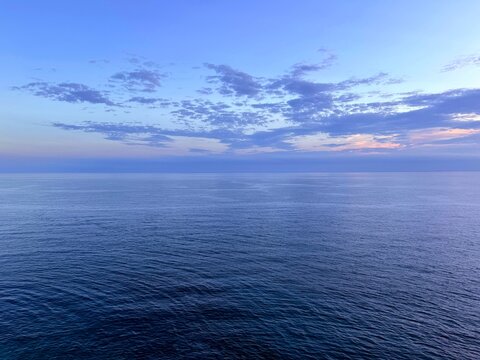 Dark blue sea and sky clouds at evening 