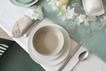 Beautiful table setting with white flowers for wedding celebration in room, top view
