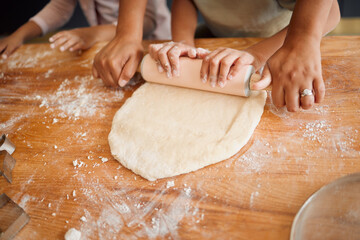 Baking, rolling pin and hands of children with dough for cake, treats and dessert for bonding, fun or skills. Family, home and young girls with ingredients, recipe and learning together in kitchen