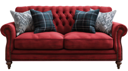 A red couch with two pillows on it