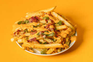 Crispy French fries loaded with bacon, cheese sauce and jalapeno pepper