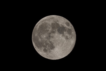 Fototapeta premium Full moon on night black sky, moon isolated on night sky