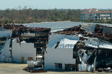Hurricane Ian destroyed boat station in Florida coastal area. Natural disaster and its consequences