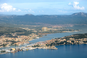 Aerial pilot cockpit view of airport runway and Croatian town city of Split with islands and sea