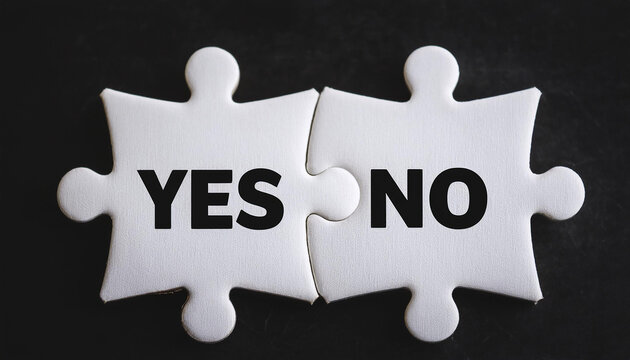 Two white puzzle pieces with text YES and NO. Decision making, two choices. Black backdrop. Close-up