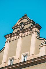 Colorful Historic Buildings and Houses on Stary Rynek Square in Poznań, Poland, with a Blue Sky and Mural Art