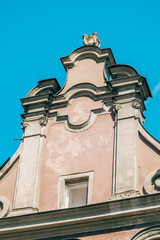 Colorful Historic Buildings and Houses on Stary Rynek Square in Poznań, Poland, with a Blue Sky and Mural Art © explorateurphotos