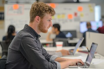 Software Engineer in Open Office Environment Collaborating with Team on Innovative Project