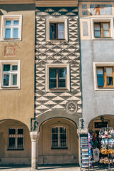 Colorful Historic Buildings and Houses on Stary Rynek Square in Poznań, Poland, with a Blue Sky and Mural Art © explorateurphotos