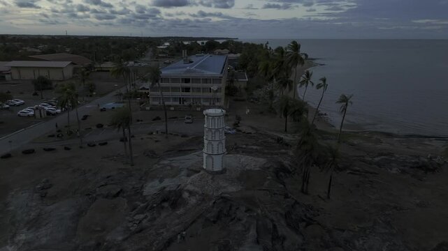 Drone does 360 around Dreyfus Tower at sunset in Kourou, French Guiana, France