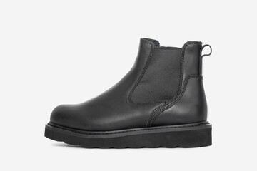 Black leather boots isolated on white background. Fashionable and durable footwear for men and women. Ideal for casual and outdoor wear in autumn and winter 