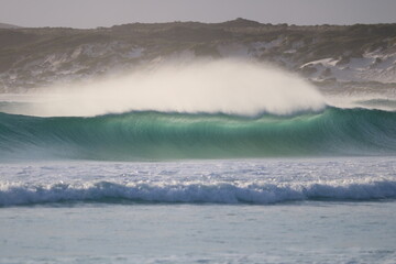 cristal wave breaking on the beach