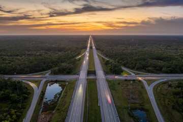 USA highway transportation infrastructure. American freeway junction with fast driving cars